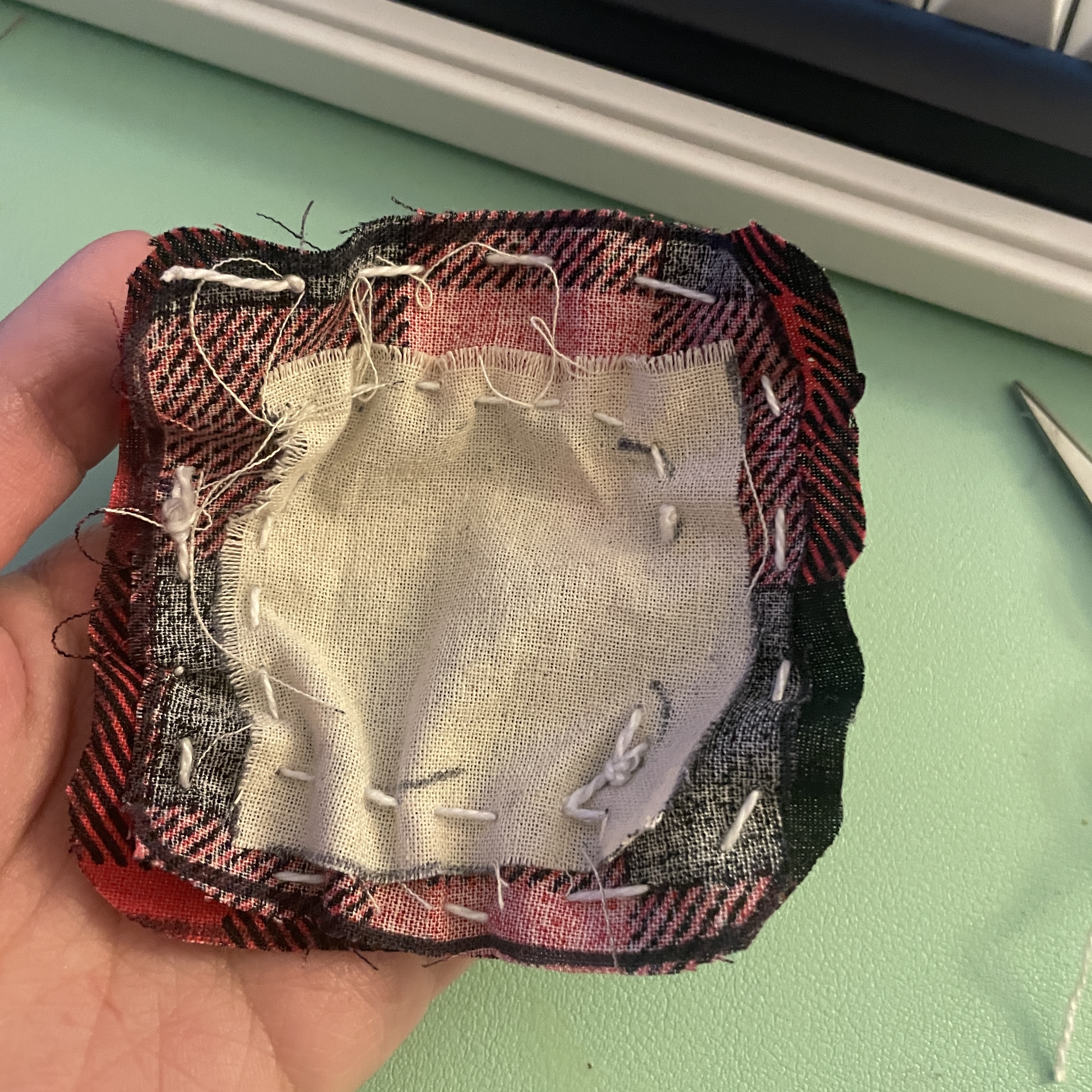 Sewing progress of medical patch prototype.